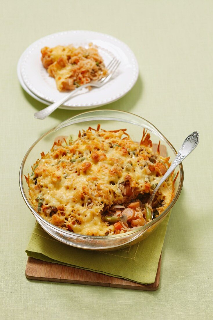 Rice bake with sausage, mushrooms, vegetables and cheese