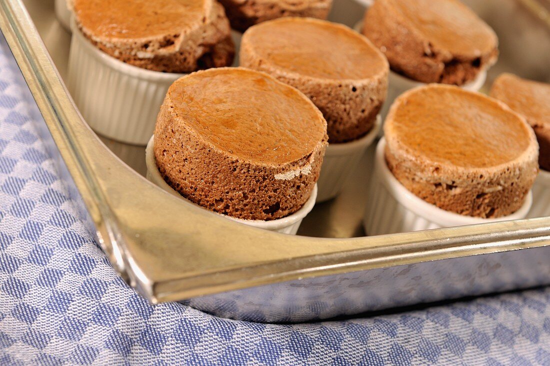 Chocolate souffles on a baking tray
