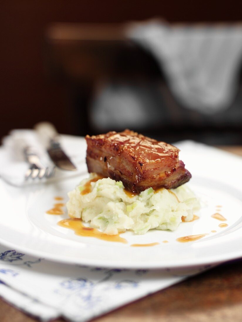 Pork belly on a bed of mashed potatoes