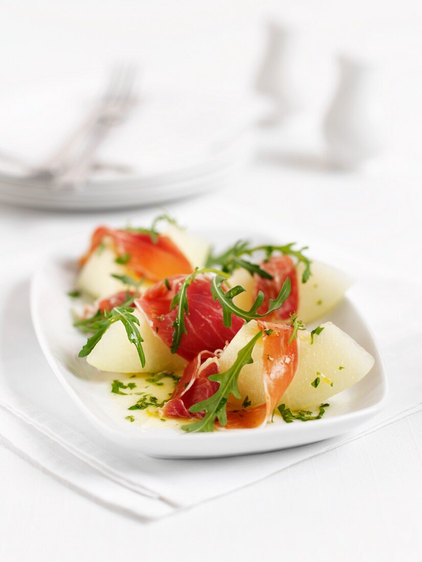Melons with raw ham and rocket