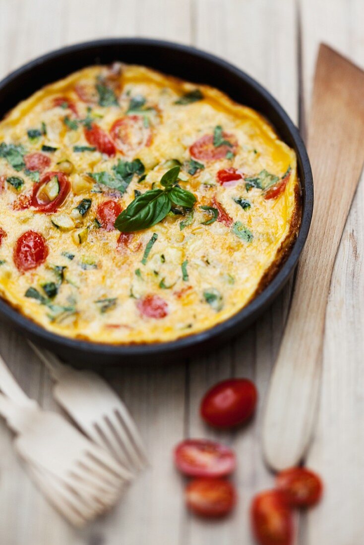 Zucchini omelette with cherry tomatoes