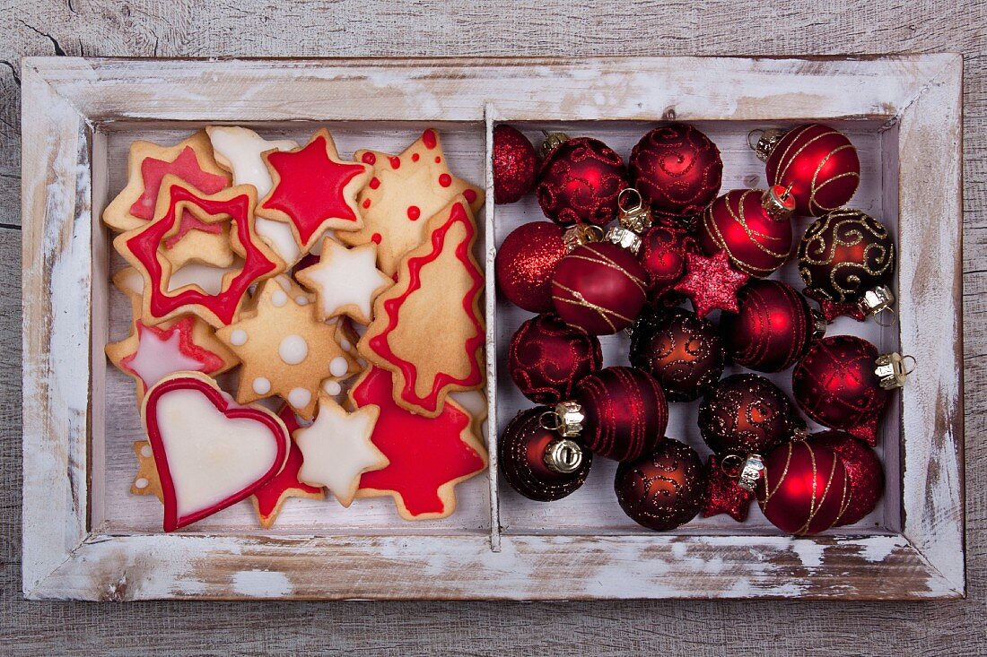 Christmas cookies and Christmas tree ball ornaments in a wooden frame