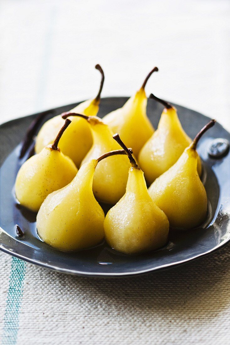 Poached pears in white wine syrup