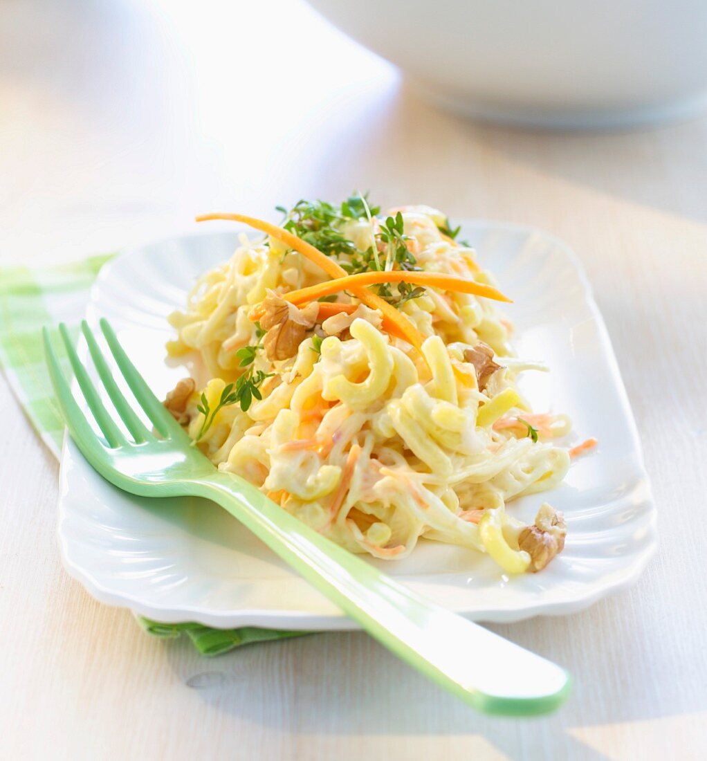 Macaroni salad with carrots, walnuts and cress