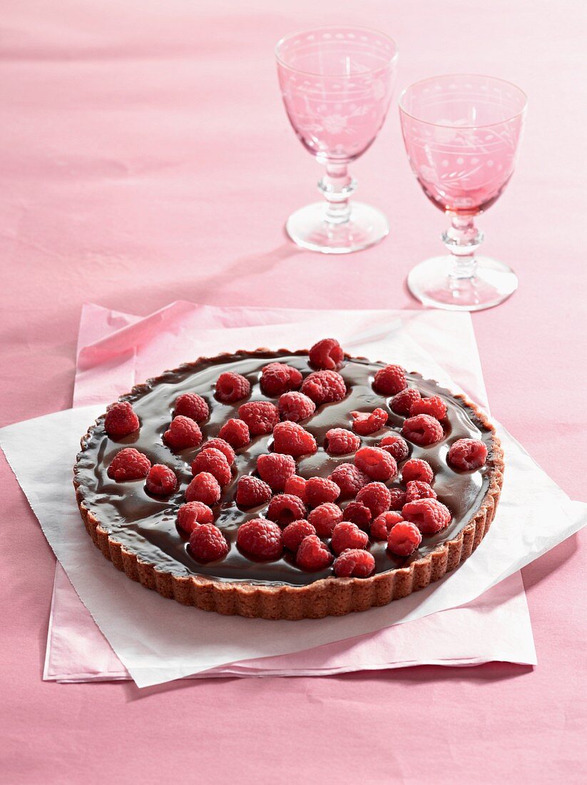 Chilli and chocolate tart topped with fresh raspberries
