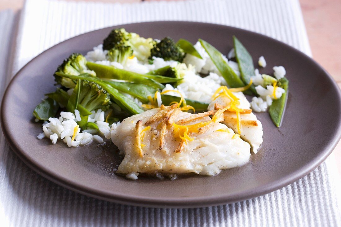 Cod with ginger and orange sauce with vegetables and rice