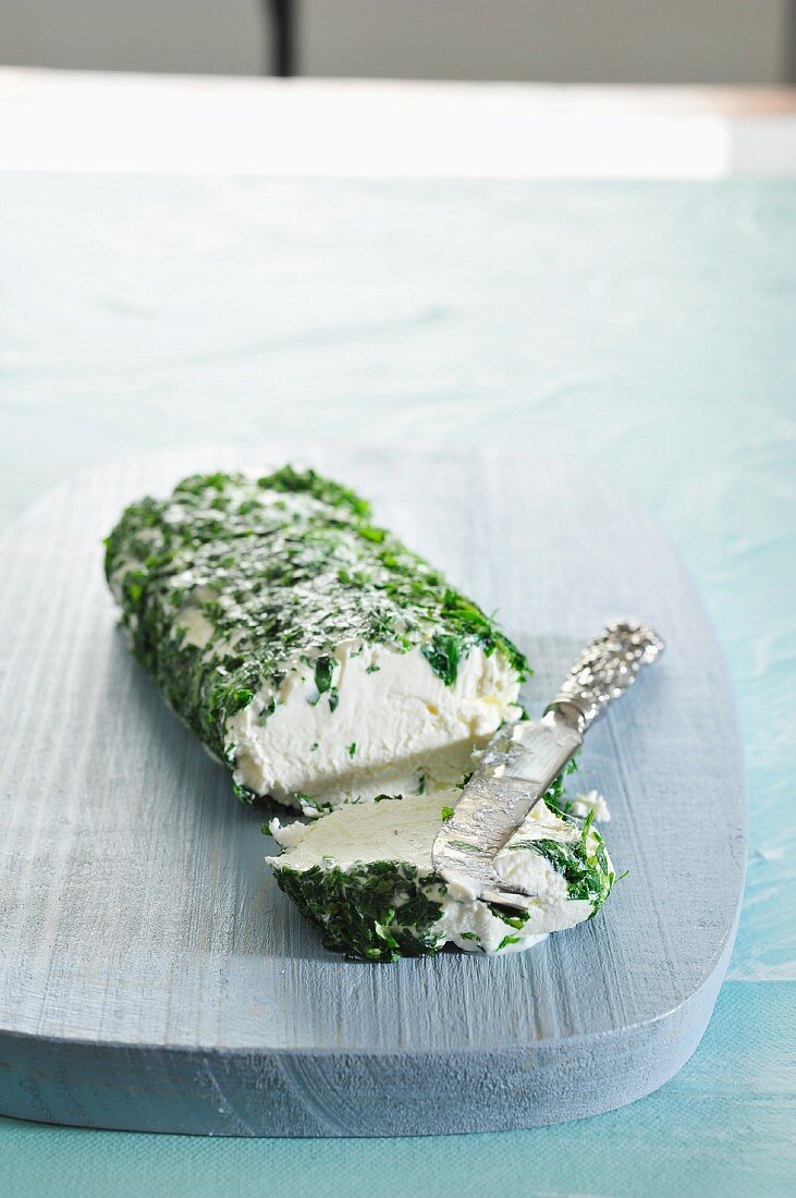 Cream cheese wrapped in herbs