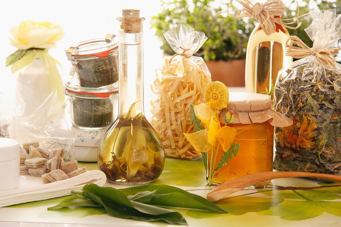 An arrangement of herb vinegar and dandelion honey