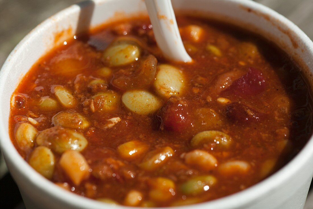 Lima Bean Stew in a Styrofoam Cup with a Plastic Spoon