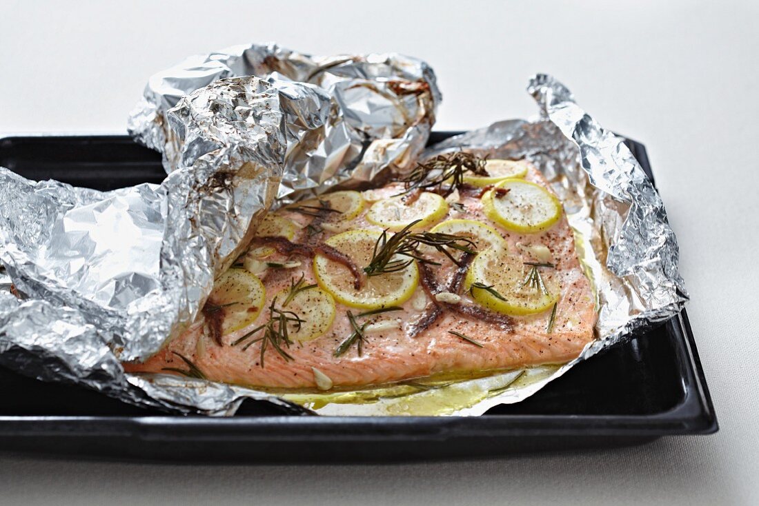Salmon fillet with anchovies, lemons and Pernod