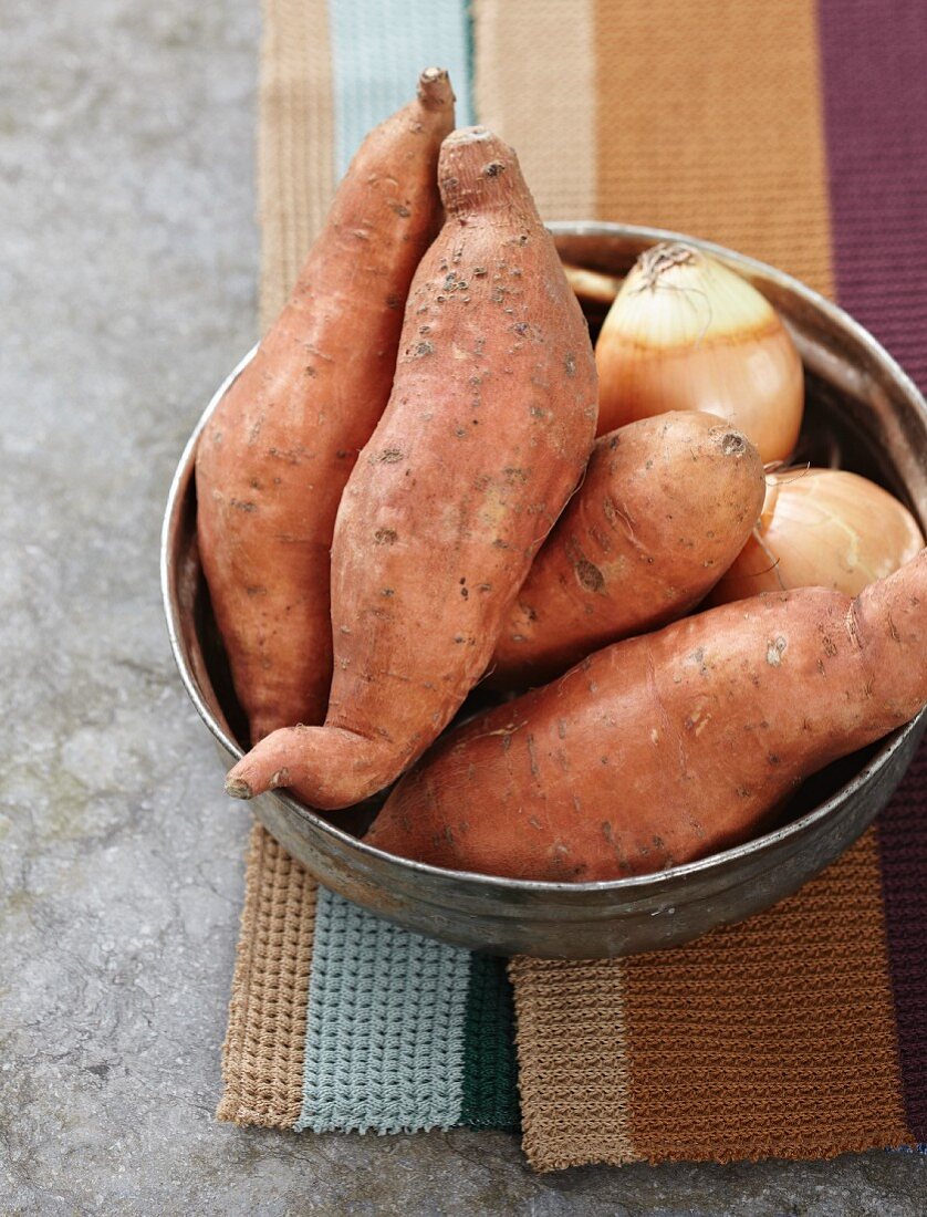 Sweet potatoes and onions in a bowl