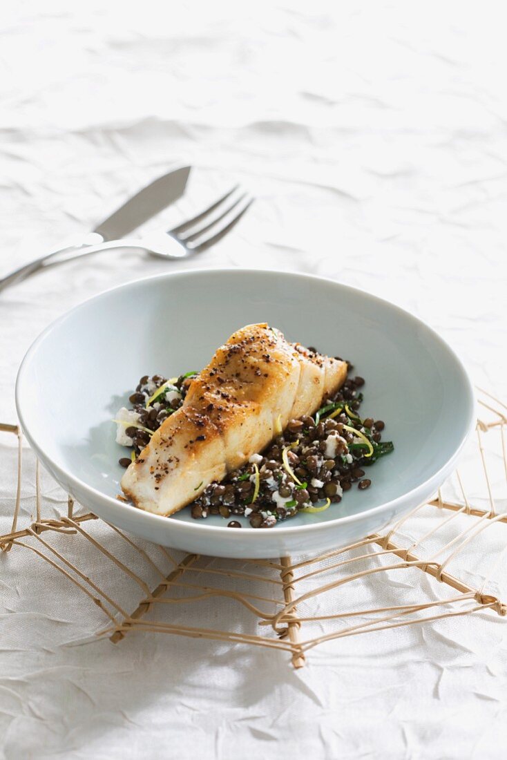 Shade-fish on a bed of lentils