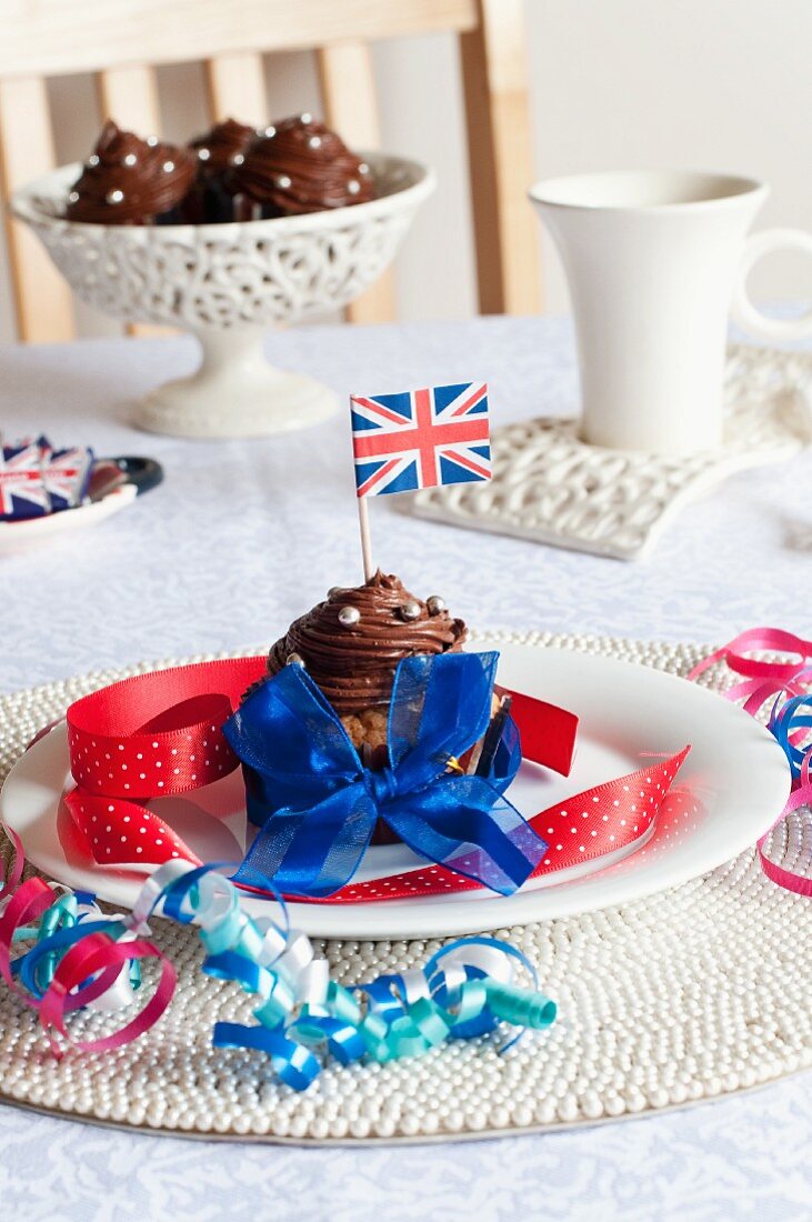 A chocolate cupcake decorated with a Union Jack