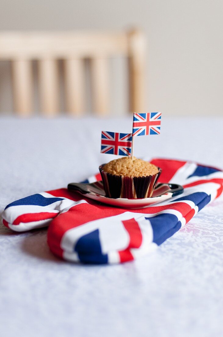 A muffin decorated with Union Jacks on an oven gove