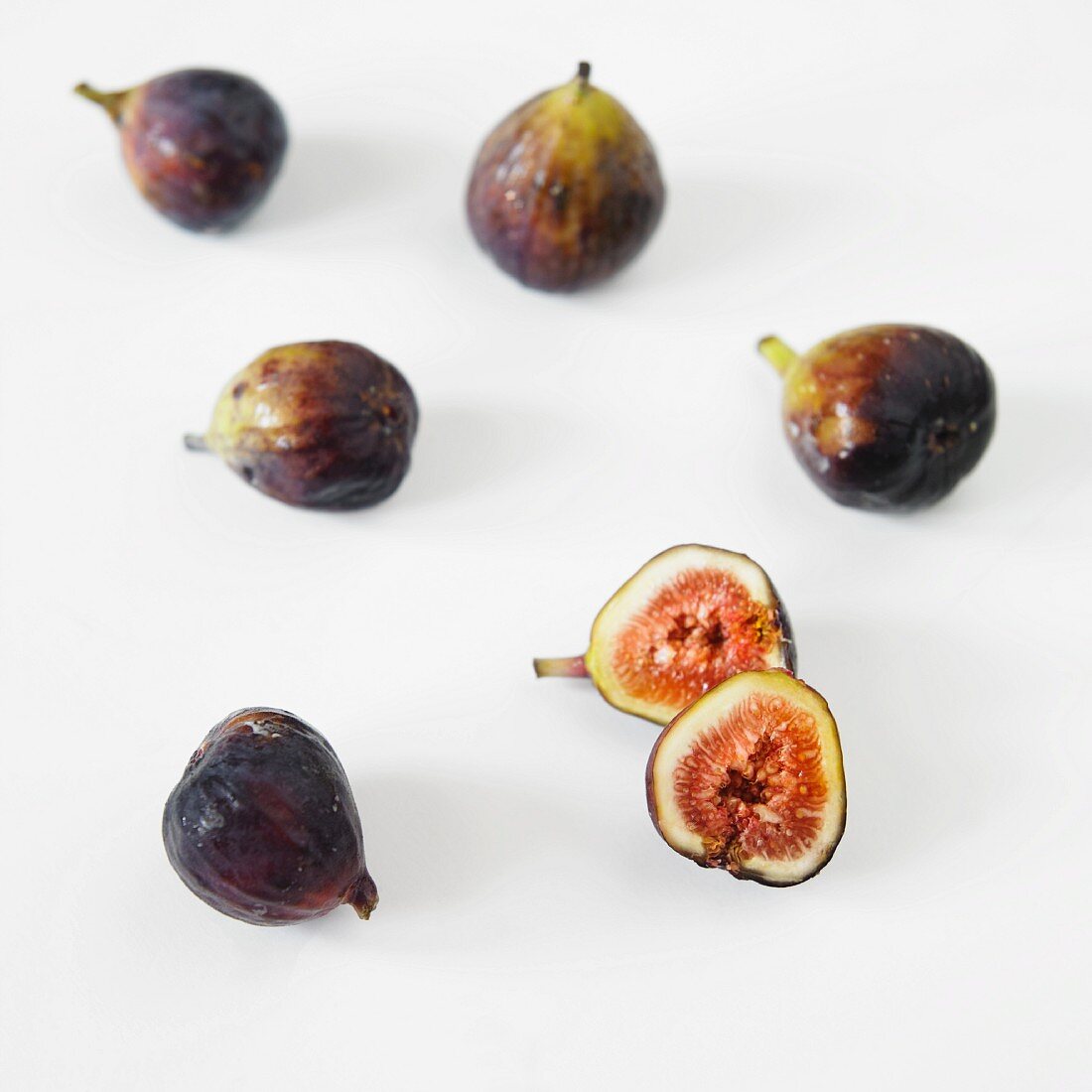 Fresh Figs on White; One Halved