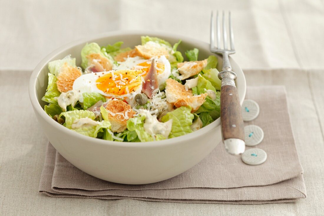 Caesar salad with croutons and egg