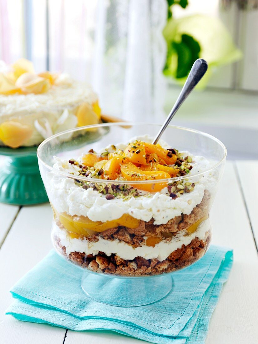 Peach trifle with pistachios and almonds