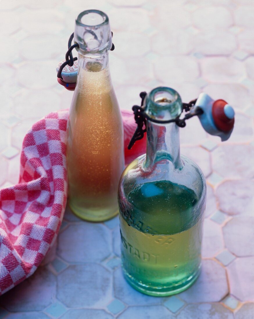 Two bottles of apple syrup