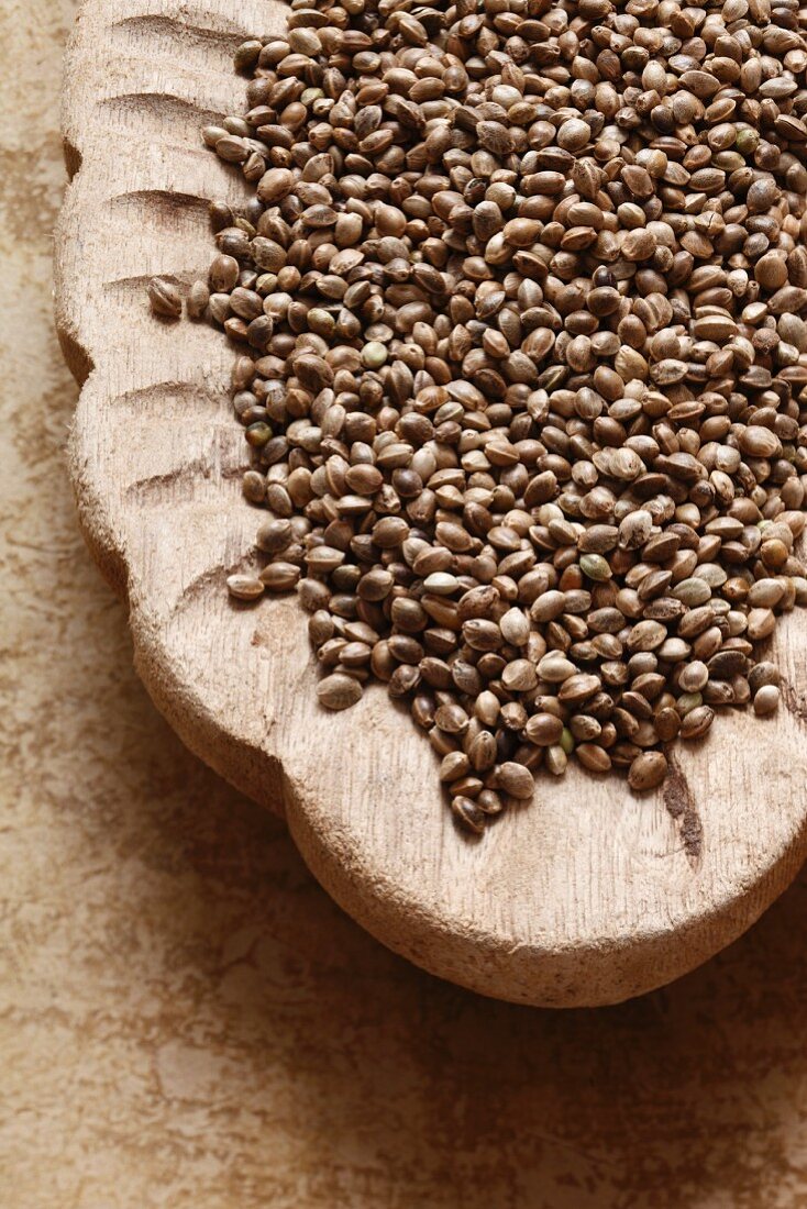 Hemp seeds in a wooden bowl