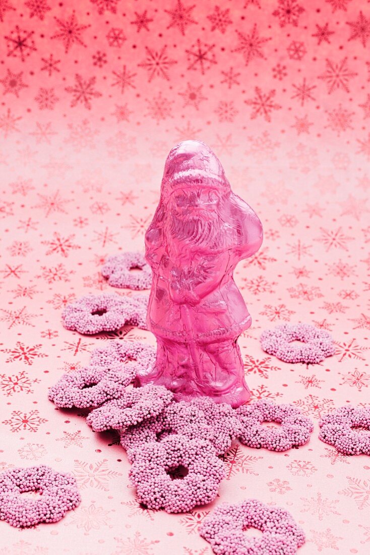 A pink Father Christmas and fondant rings