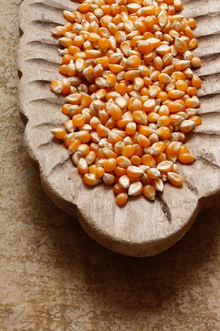 Corn kernels in a wooden bowl