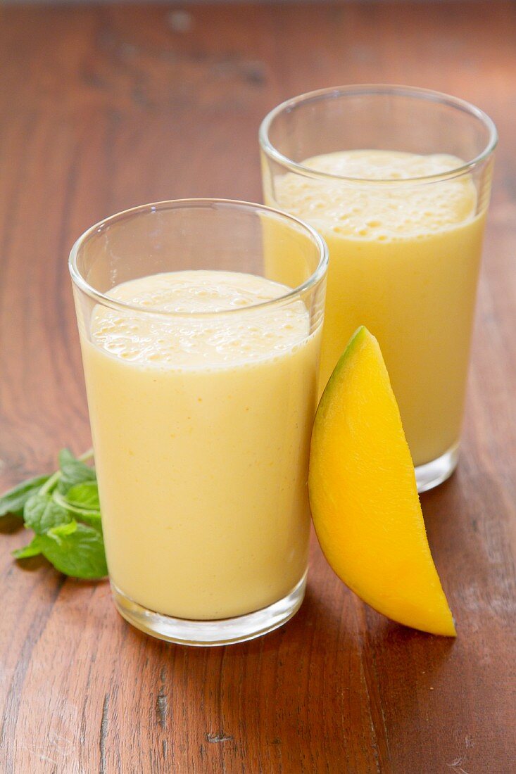 Two glasses of mango lassi