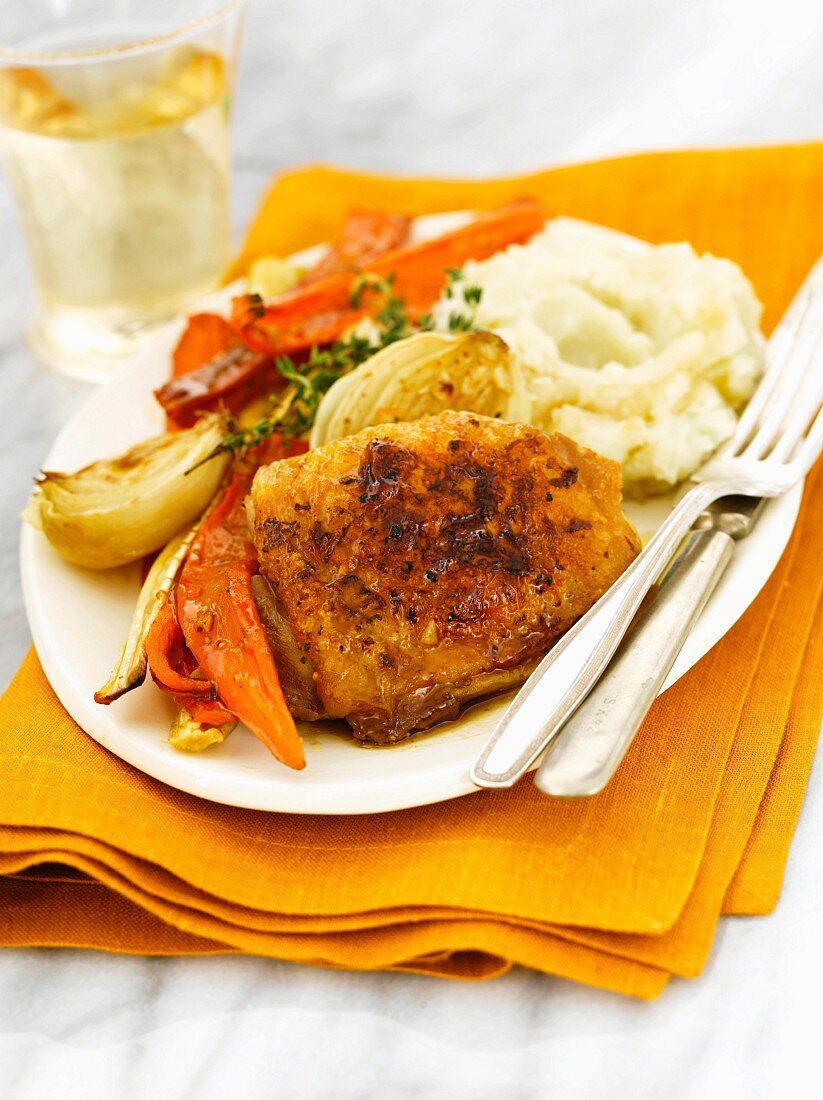 Serving of Roasted Chicken Thighs and Vegetables with Mashed Potatoes