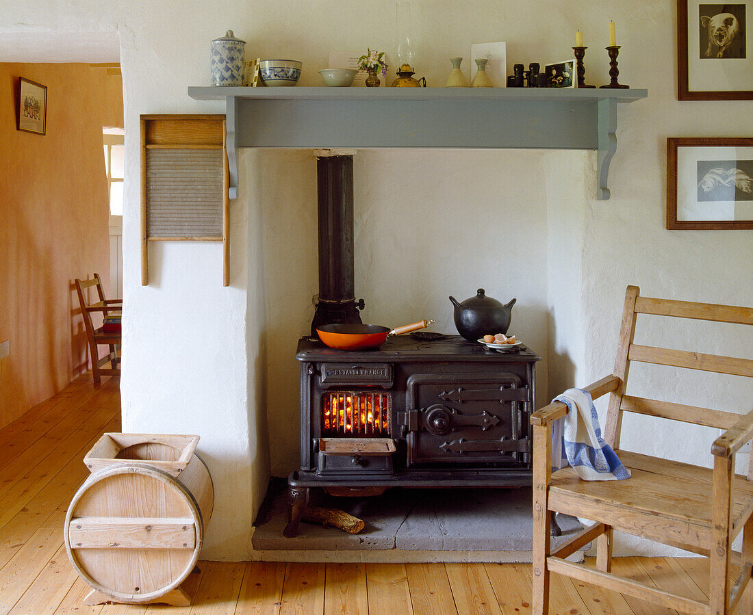 Kitchen with wood-burning stove and cookware