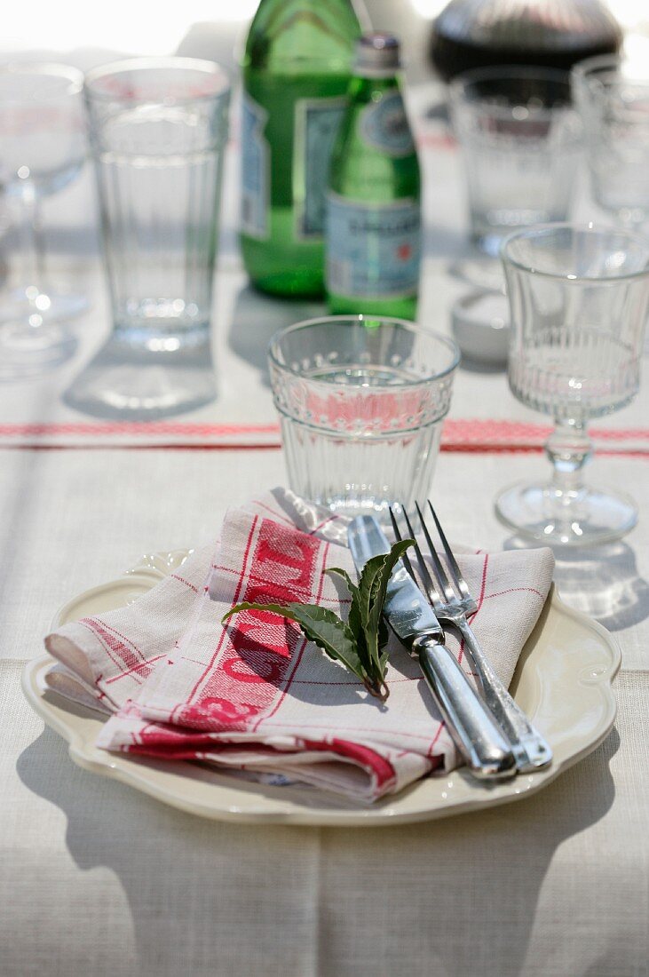 A simple place setting on a linen place mat