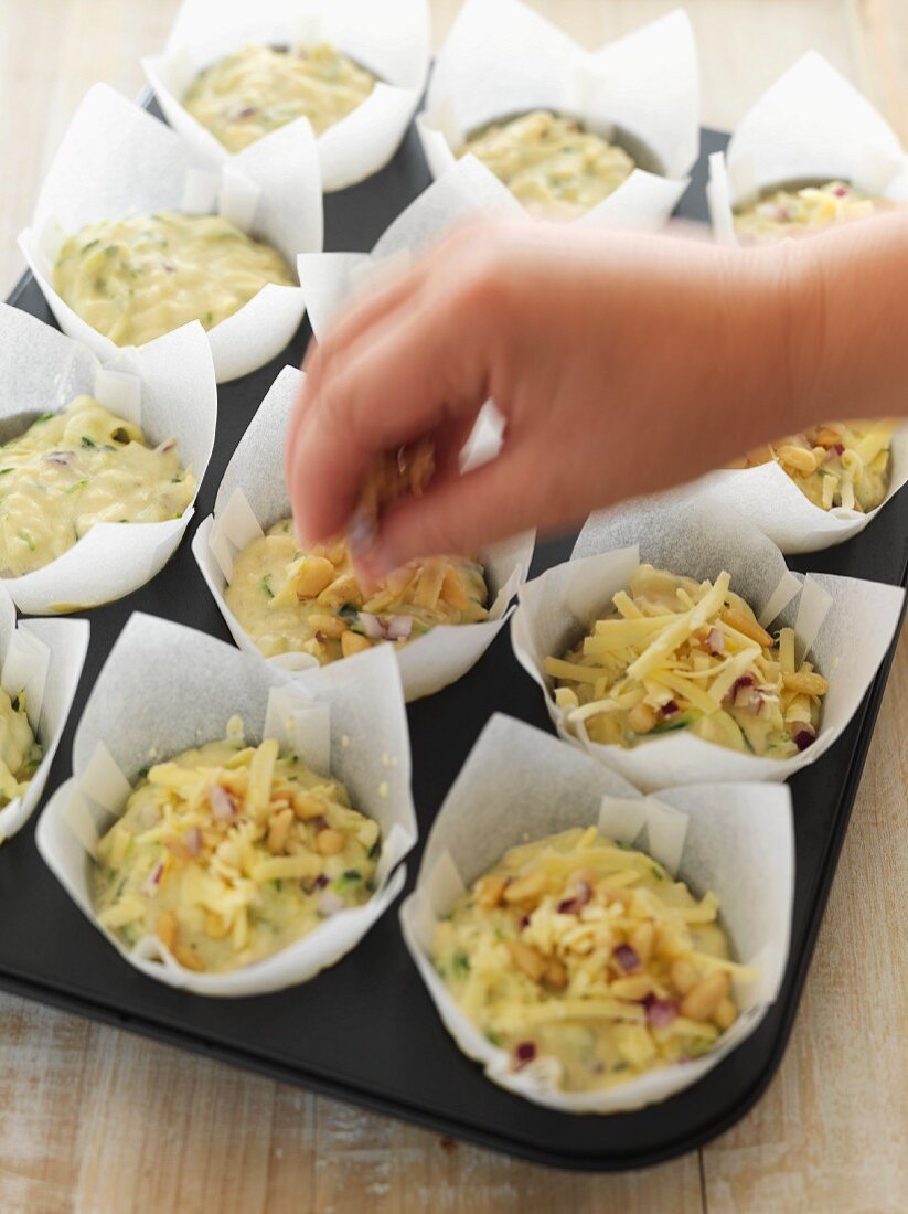Courgette and cheese muffins being prepared