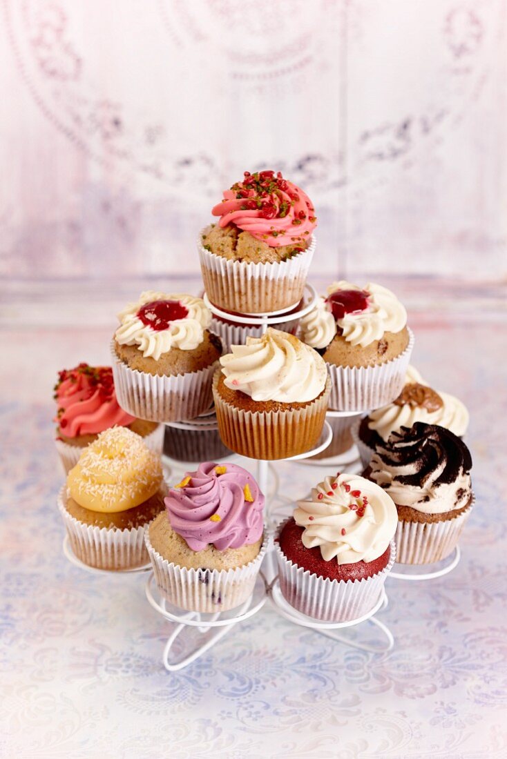 Various cupcakes on a cake stand