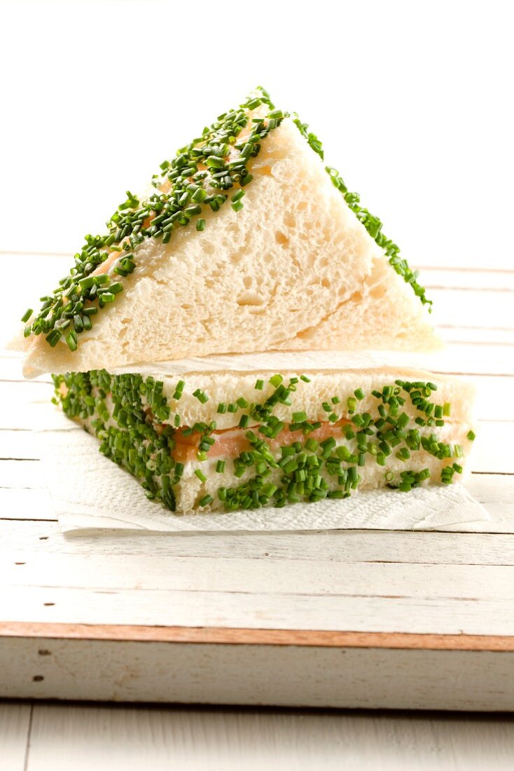 A salmon sandwich with chives