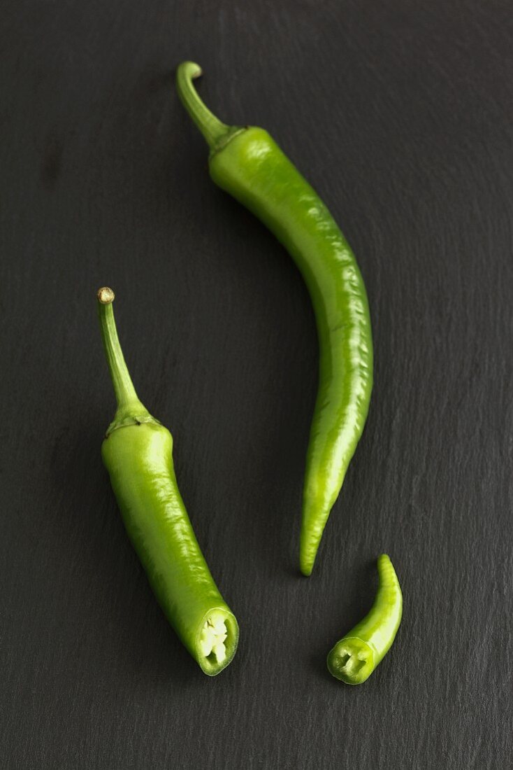 Green chilli pepper, whole and sliced
