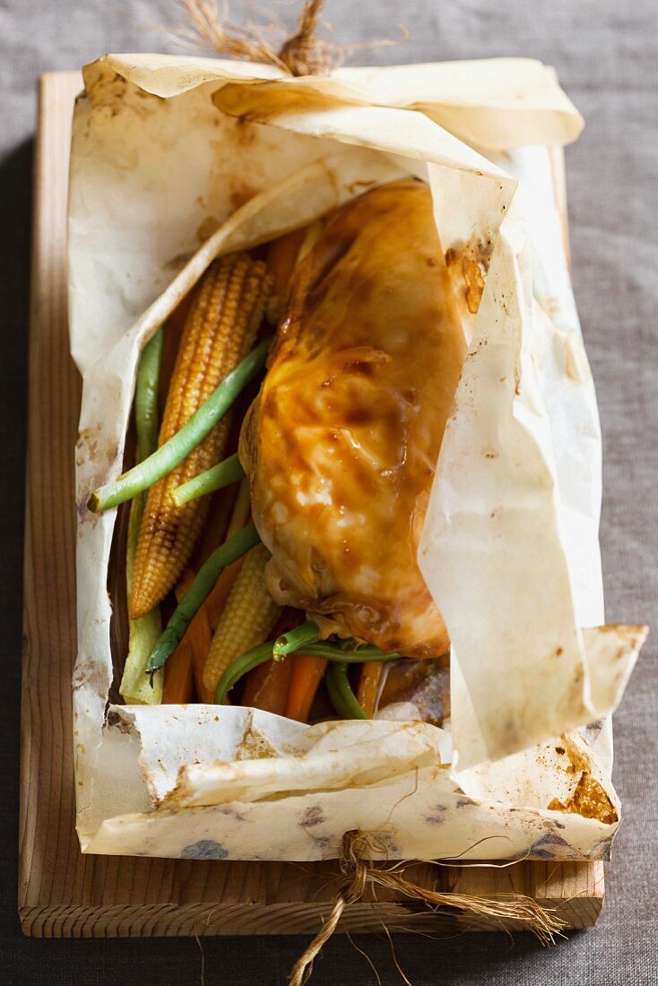 Chicken breast with vegetables in parchment paper