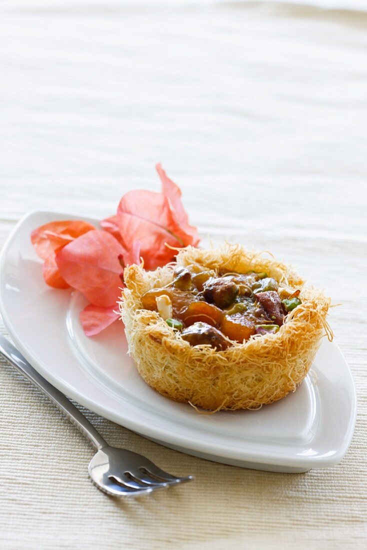A kenafeh tartlet filled with dried fruits