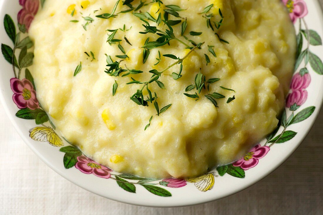 Cream Corn Polenta with Fresh Thyme in a Bowl; From Above