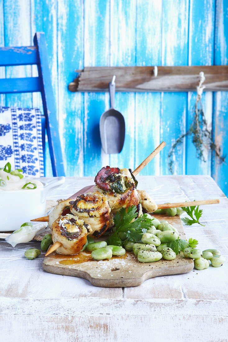 Chicken roulade kebab with pancetta, sage and broad beans