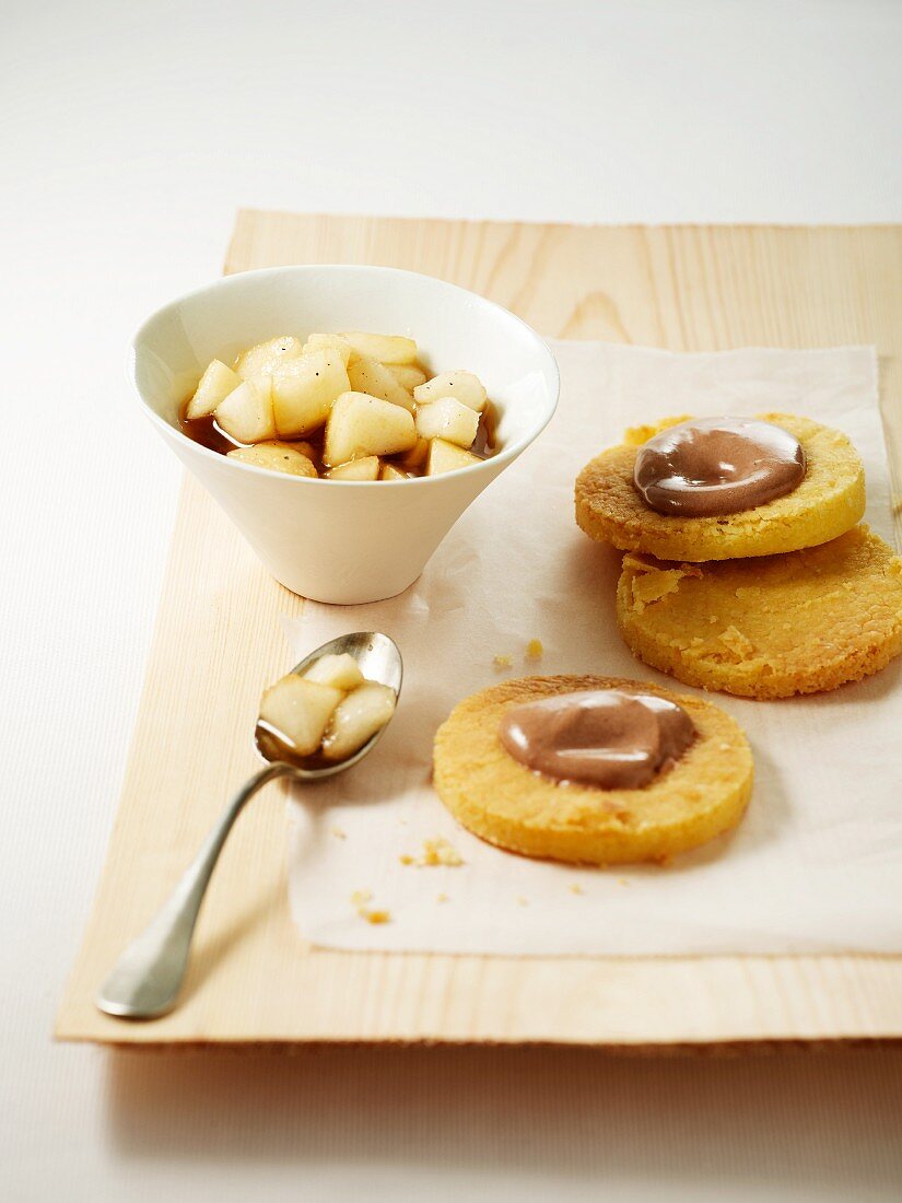 Pears in chocolate sauce and biscuits with chocolate glaze