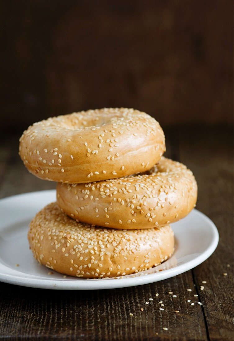 A stack of three sesame seed bagels