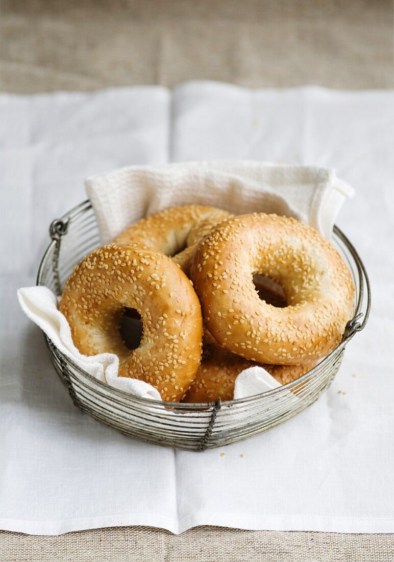 Sesame seed bagels in a breadbasket