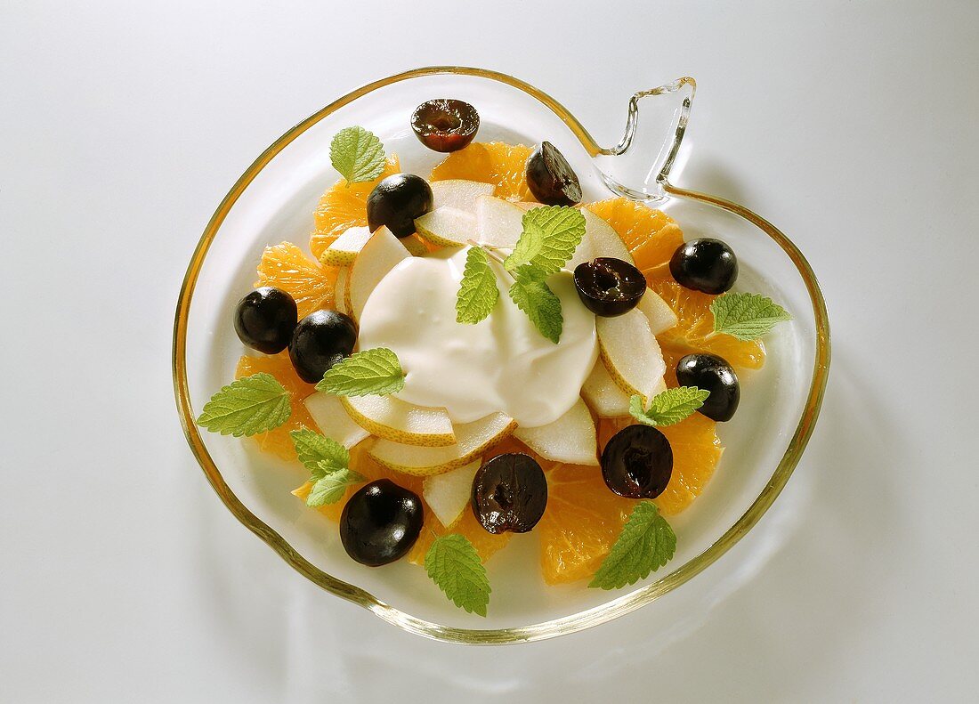 Black grape & orange fruit salad with cream & mint