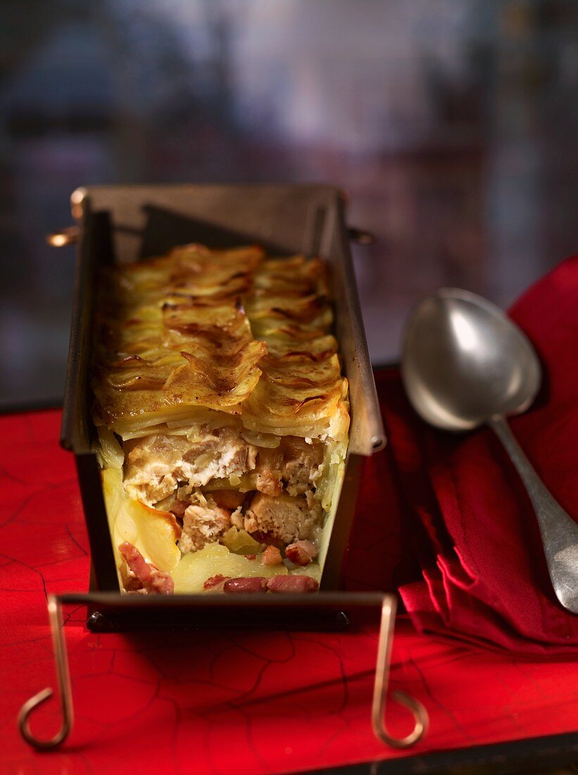 Chicken pie topped with potatoes