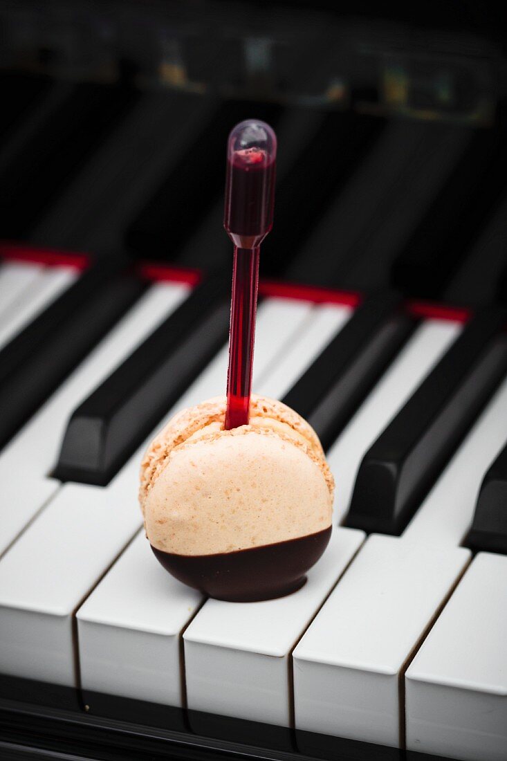 A macaroon on a piano