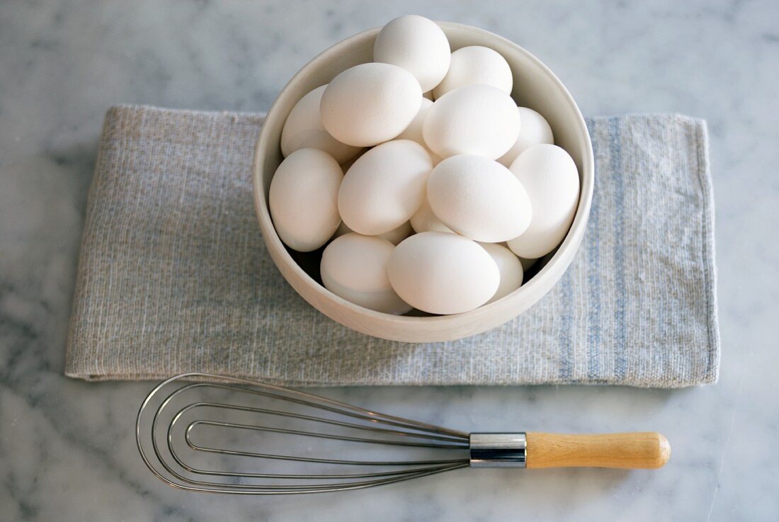 Bowl of White Eggs; Whisk; From Above