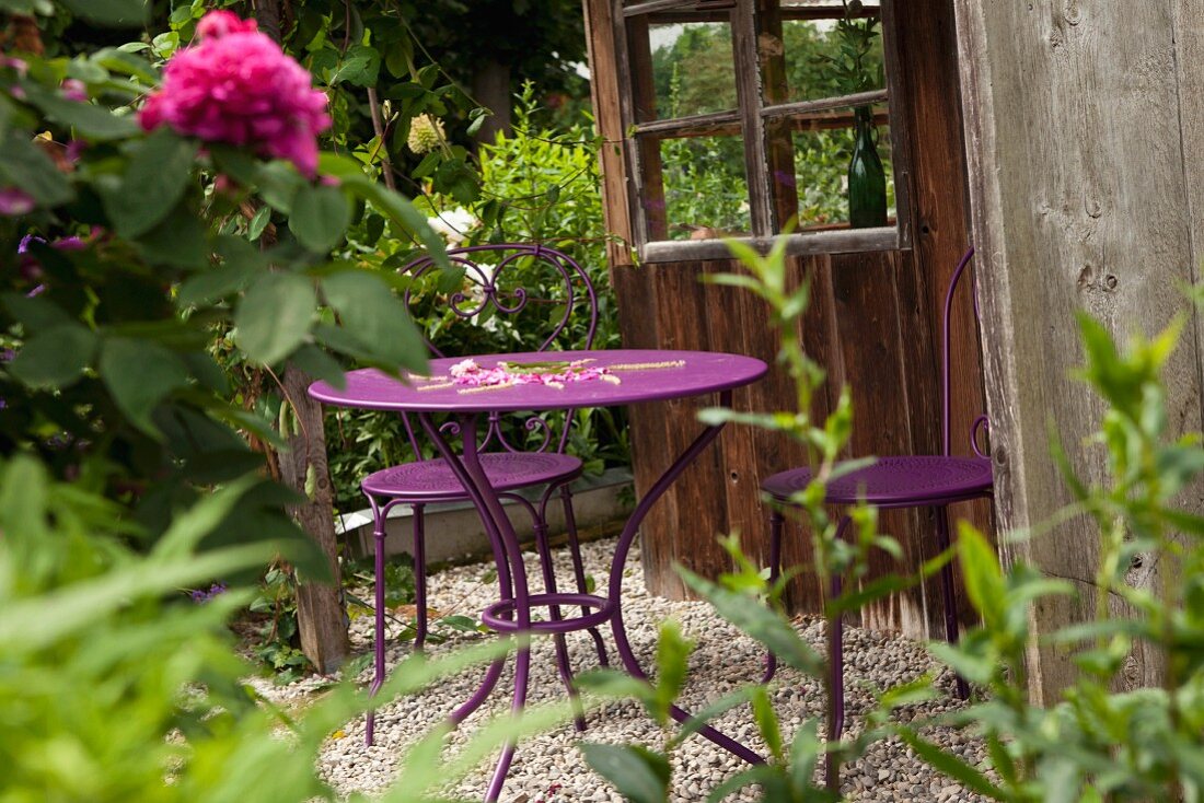 Purple metal garden table and chairs