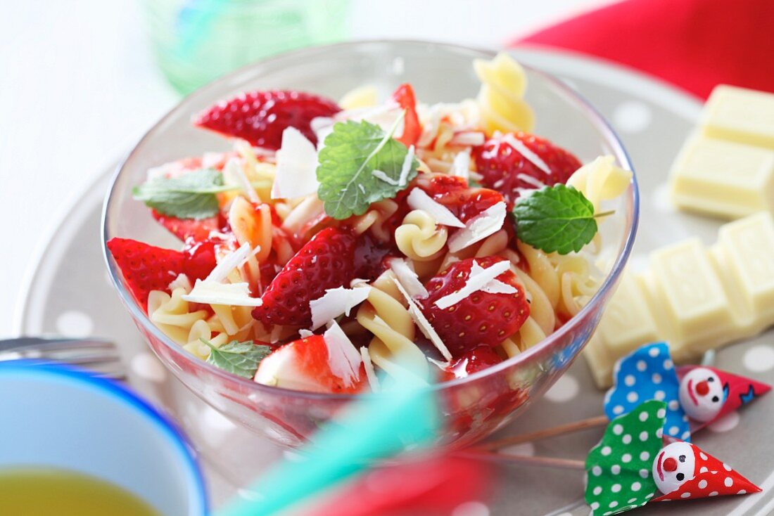 Sweet pasta with strawberries and white chocolate for children