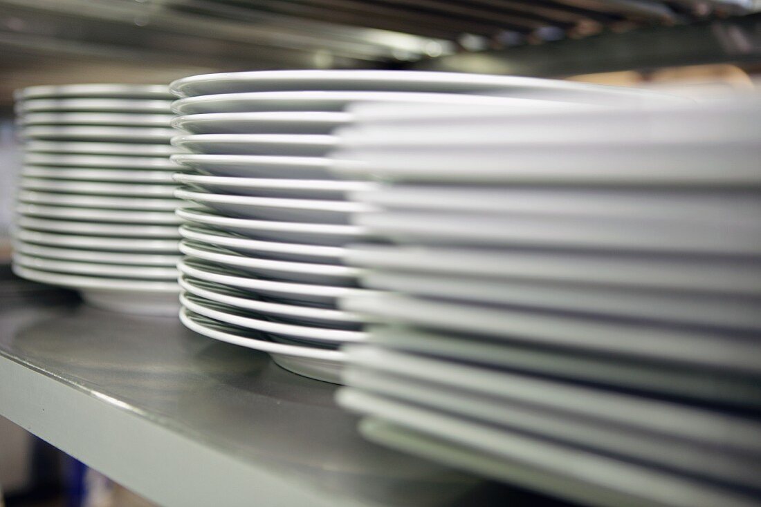 Stacks of plates in a commercial kitchen