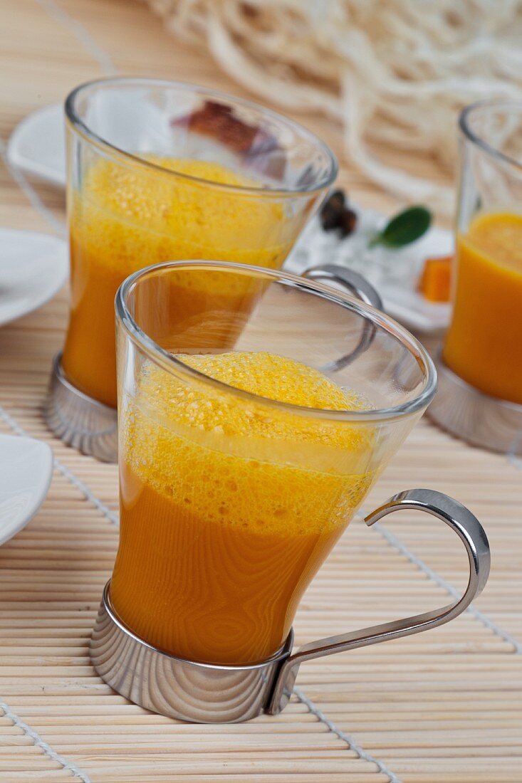 Glasses of carrot soup