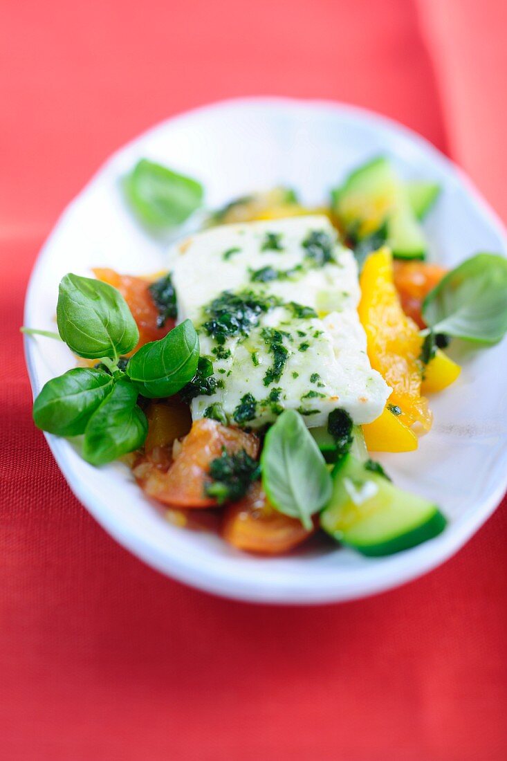 Sweet and sour vegetables with sheep's cheese and basil