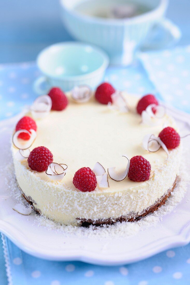 Mango and coconut cake with raspberries